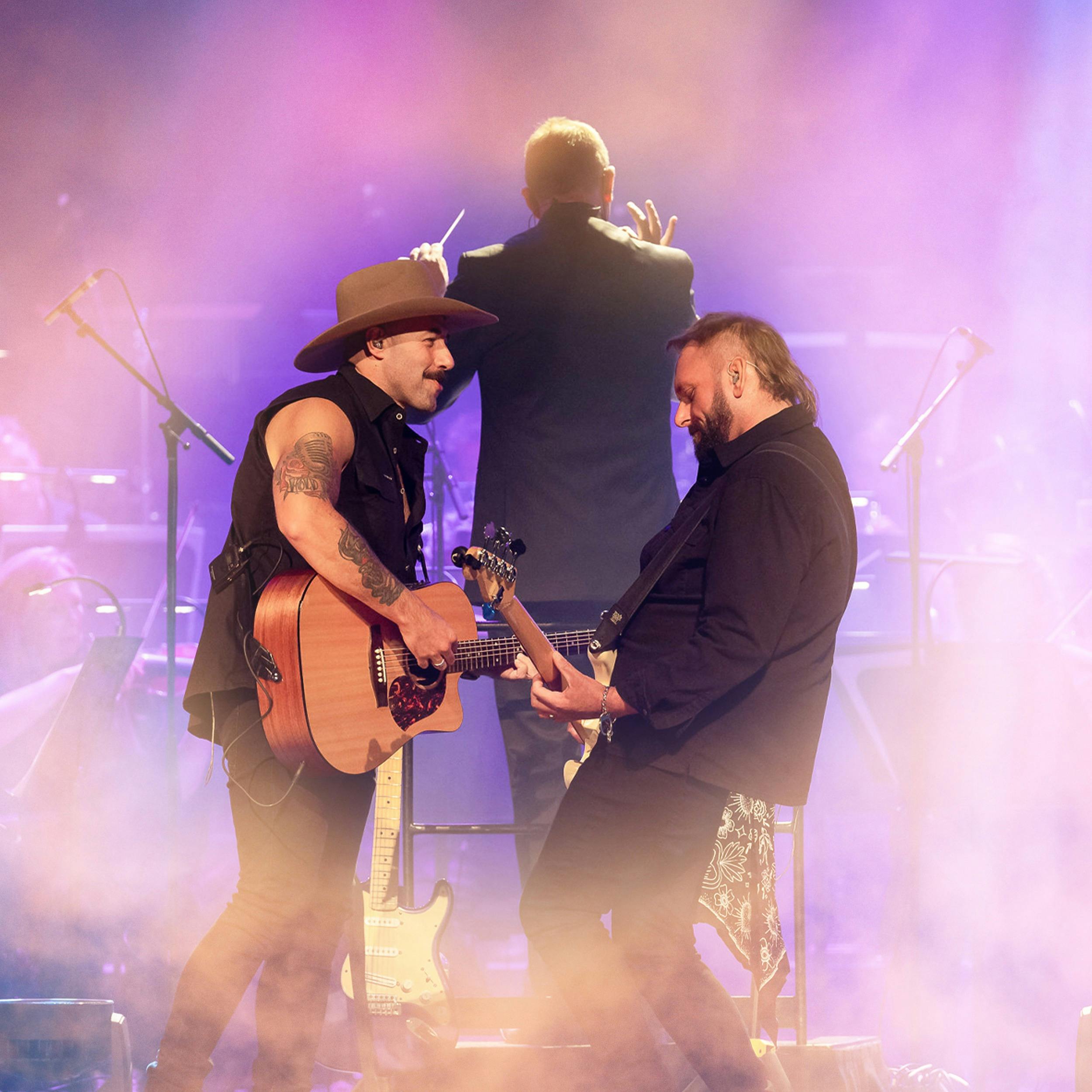 the wolfe brothers in front of the conductor