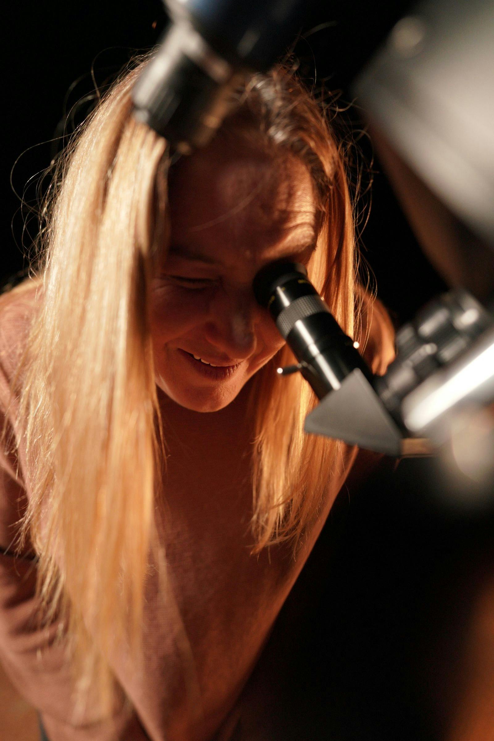 Lady looking into an eyepiece