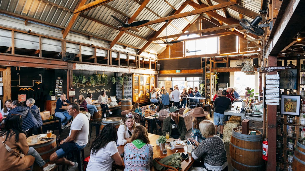 Inside Granddad Jack's Craft Distillery in Miami full of people during an event