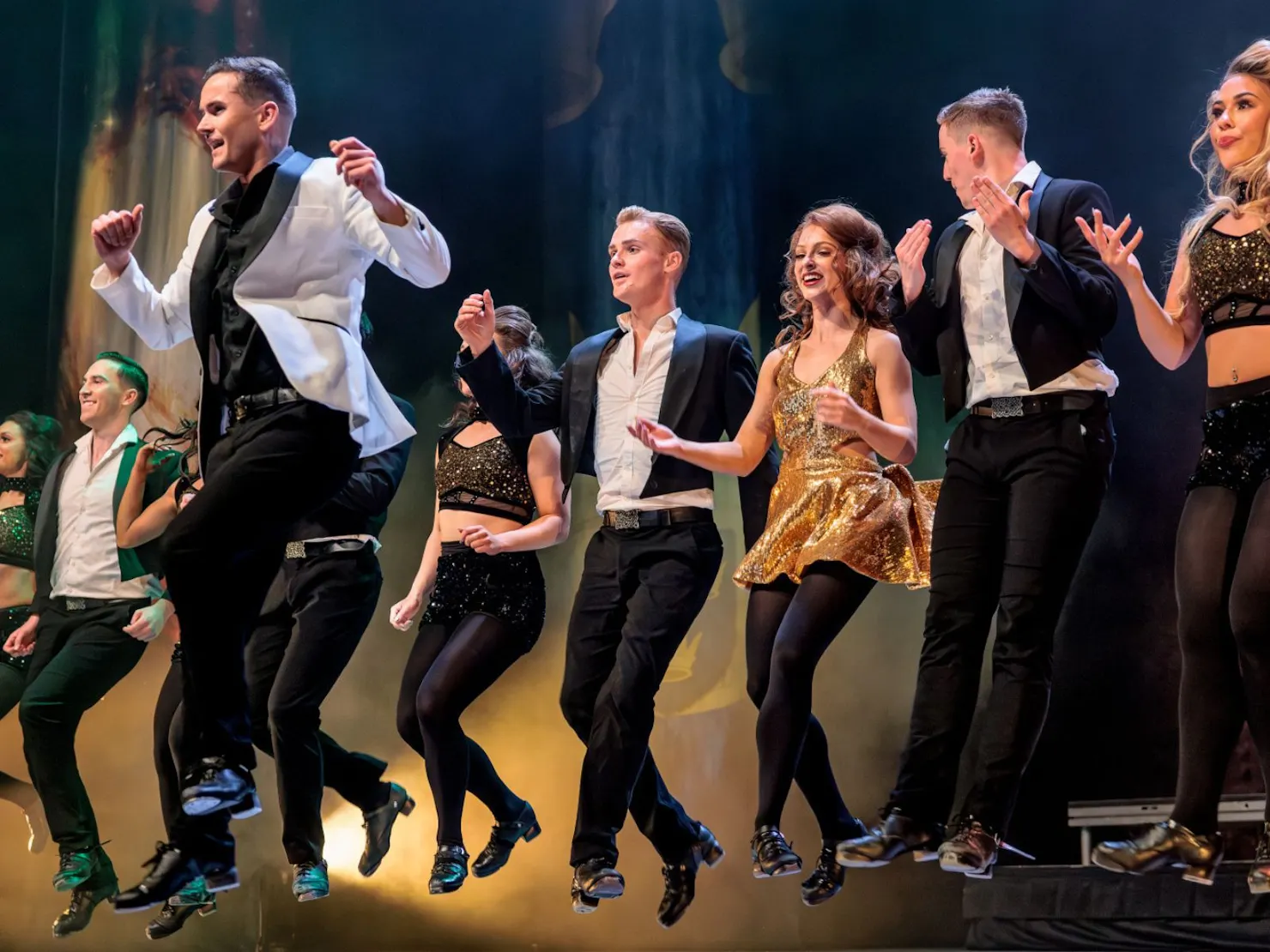 8 dances doing Irish dancing in the air