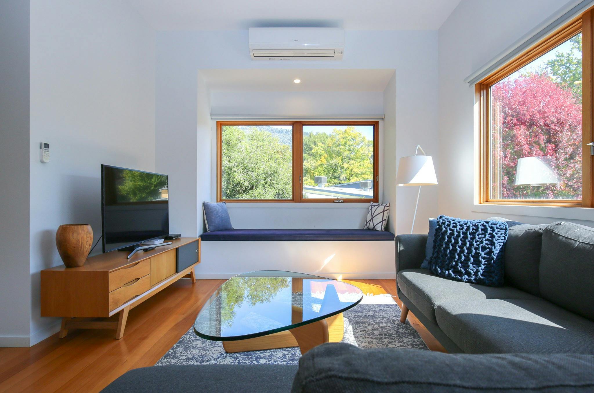 Living area with TV at The Stelvio Villas Alpine Valley Getaways