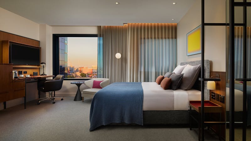 Next Queen Room with view of the city at the window