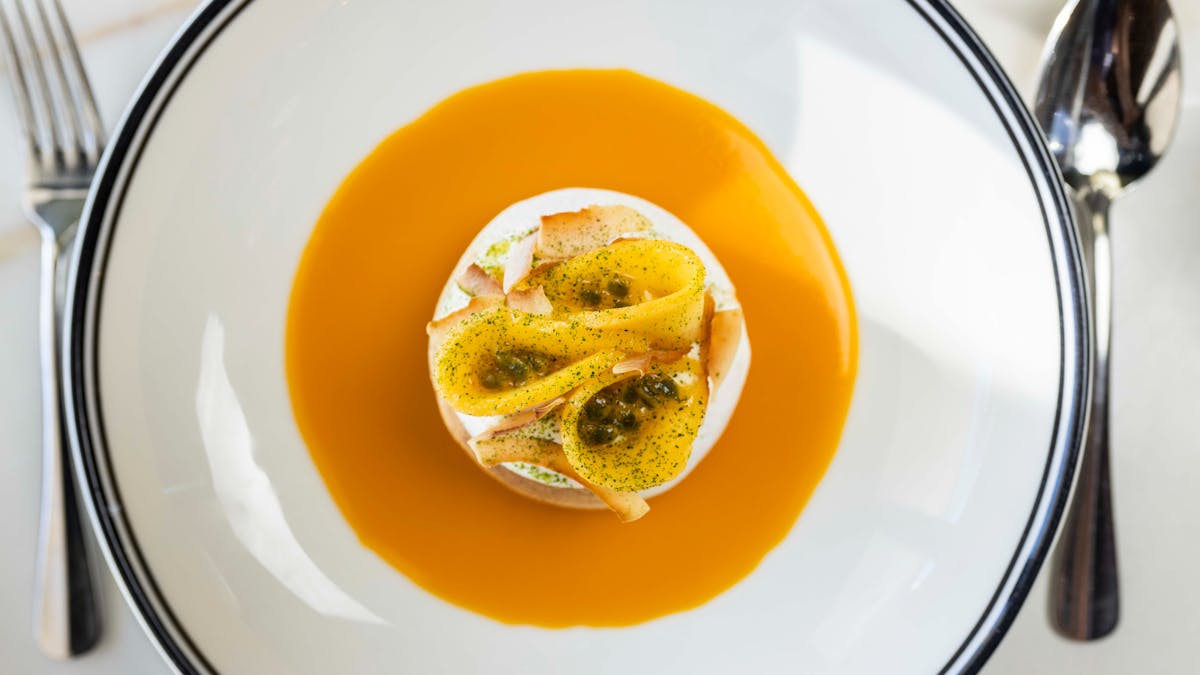 Summer pavlova, mango, passionfruit, coconut cream