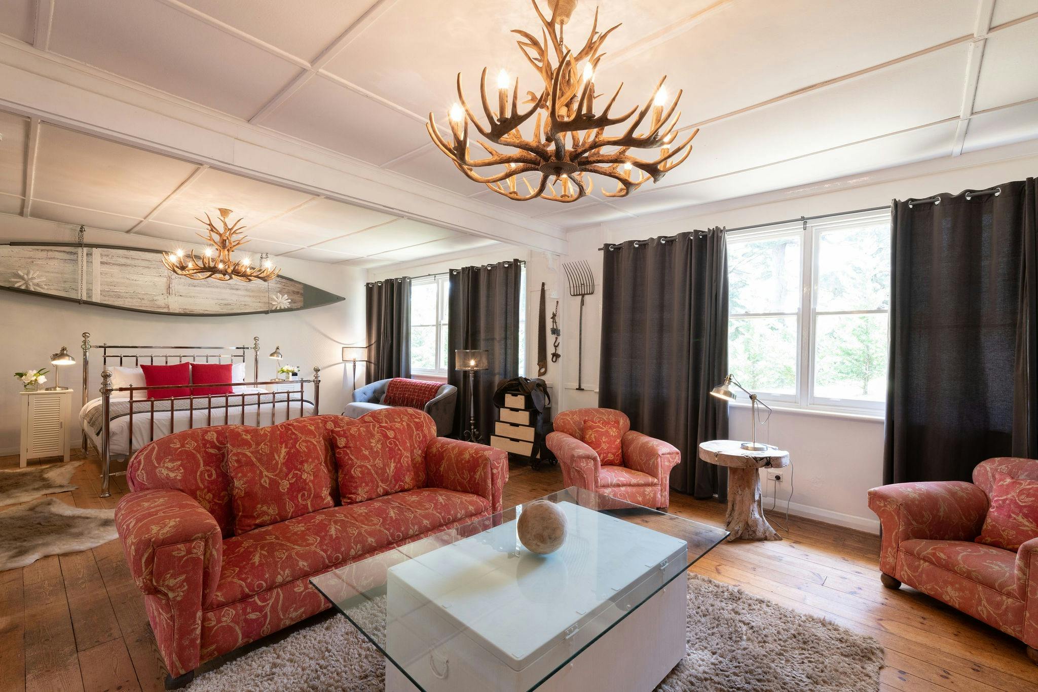 King sized bed overlooking gardens in Gardeners Cottage