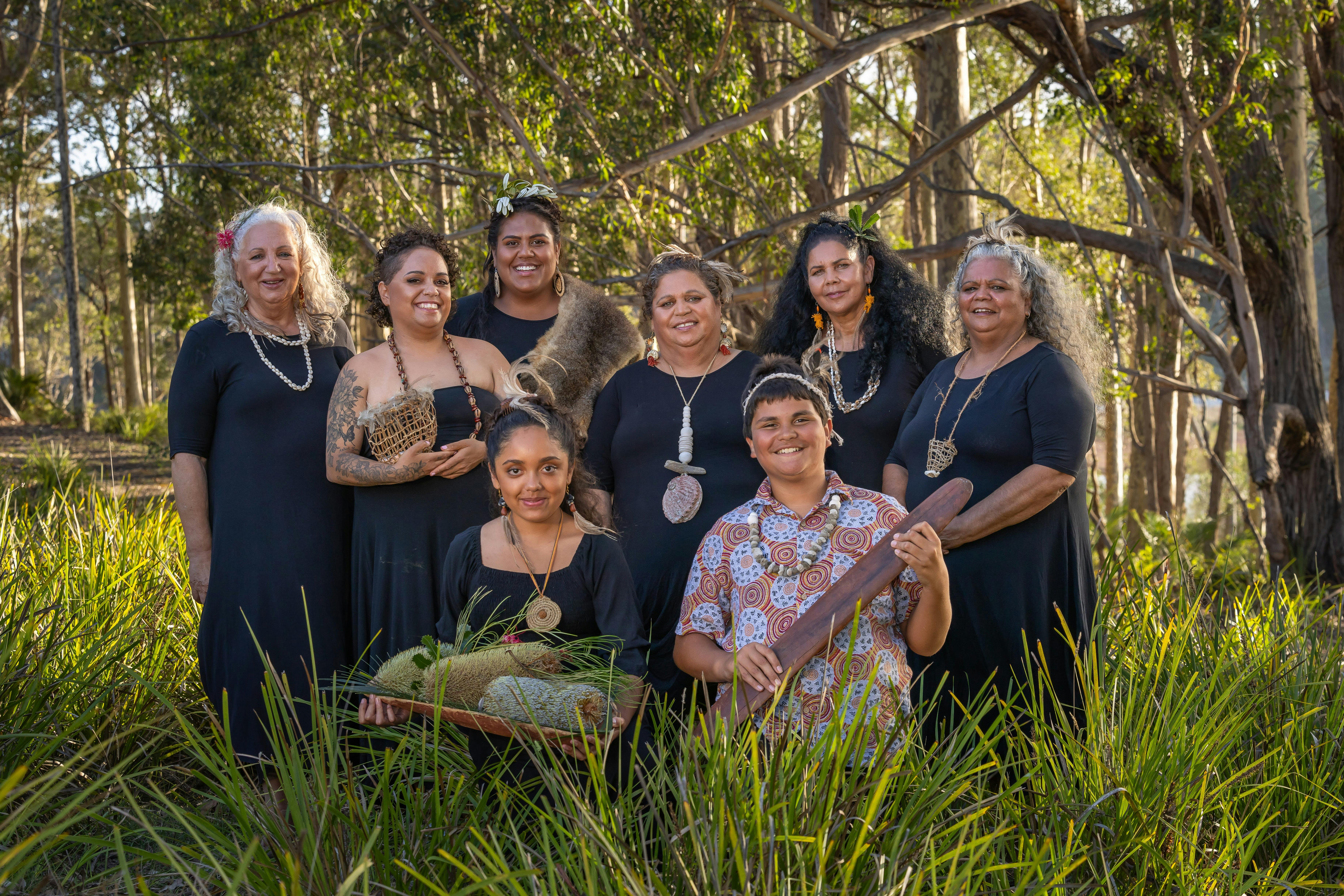 group of people in a bush setting