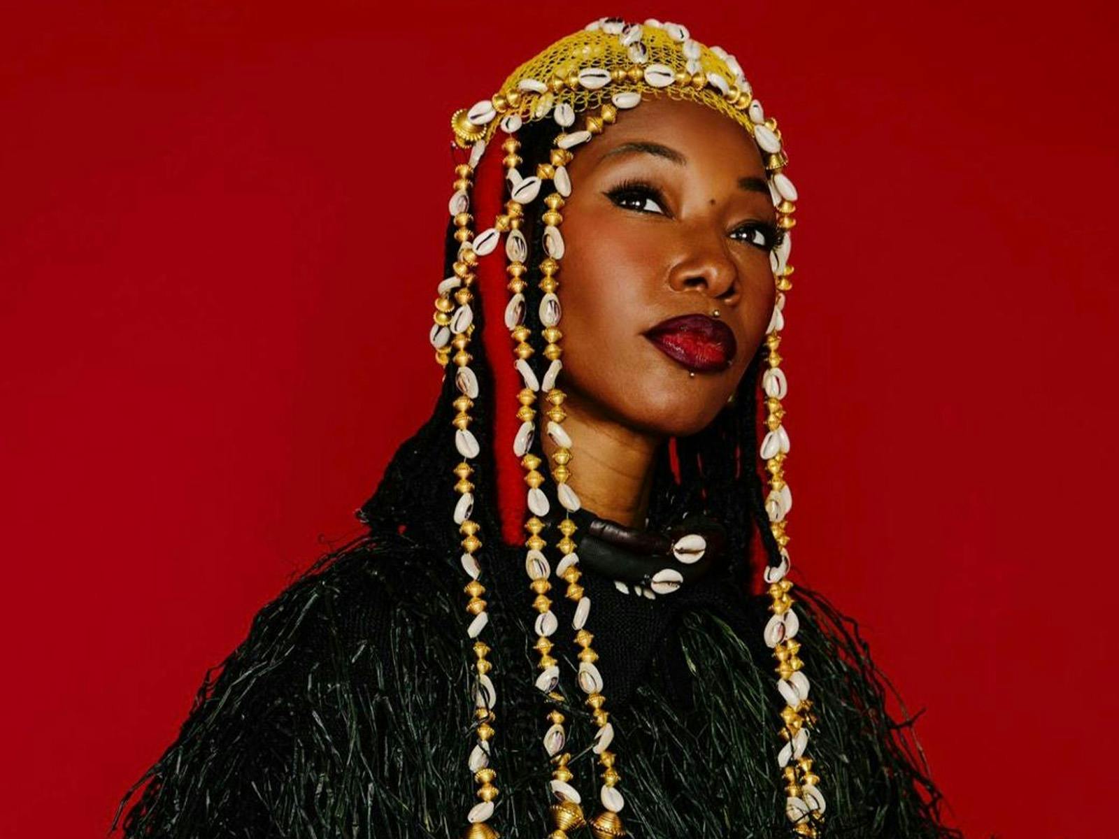 Fatoumata Diawara looking to distance with red background