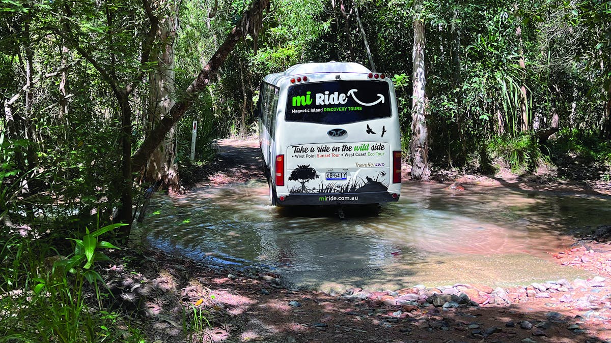 MI Ride Eco Tour traverses creeks amongst bushland along the West Point track on Magnetic Island.