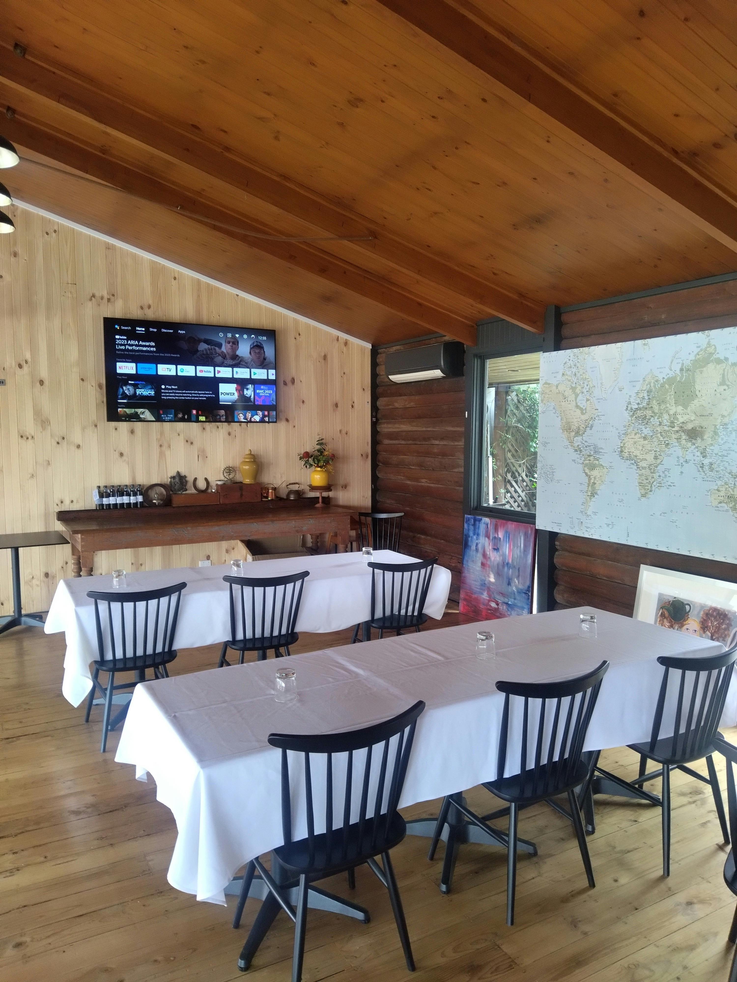 Tables and chairs set up for a meeting