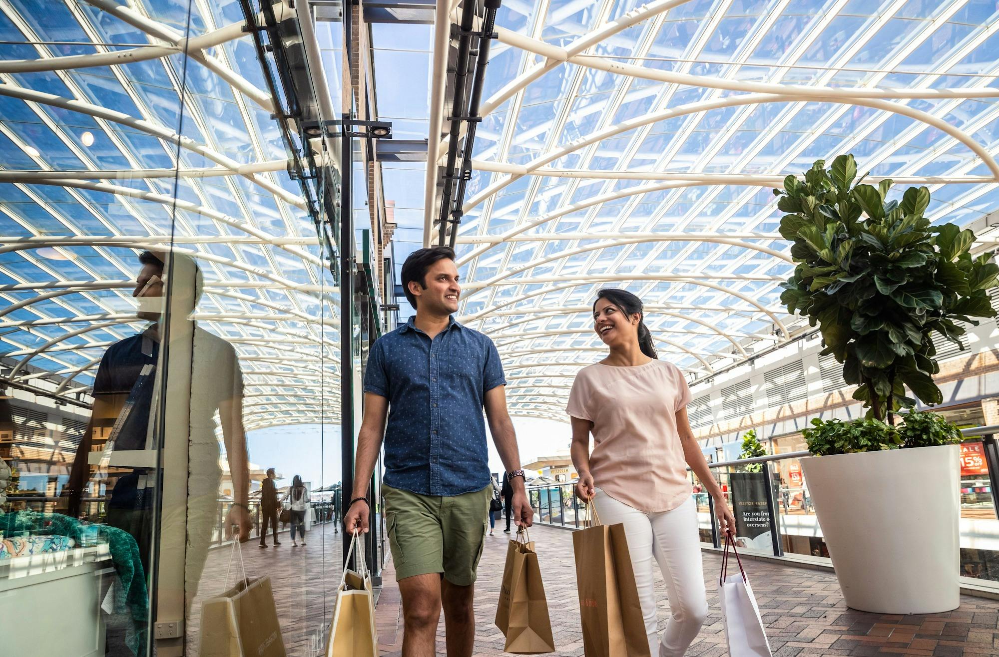 Couple shopping with bags at shopping centre
