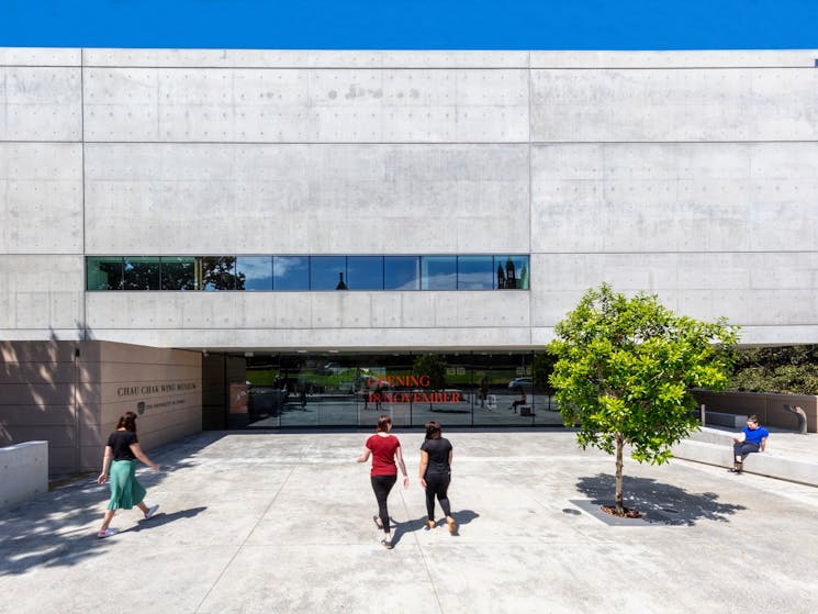 People walking into the entrance of the new museum