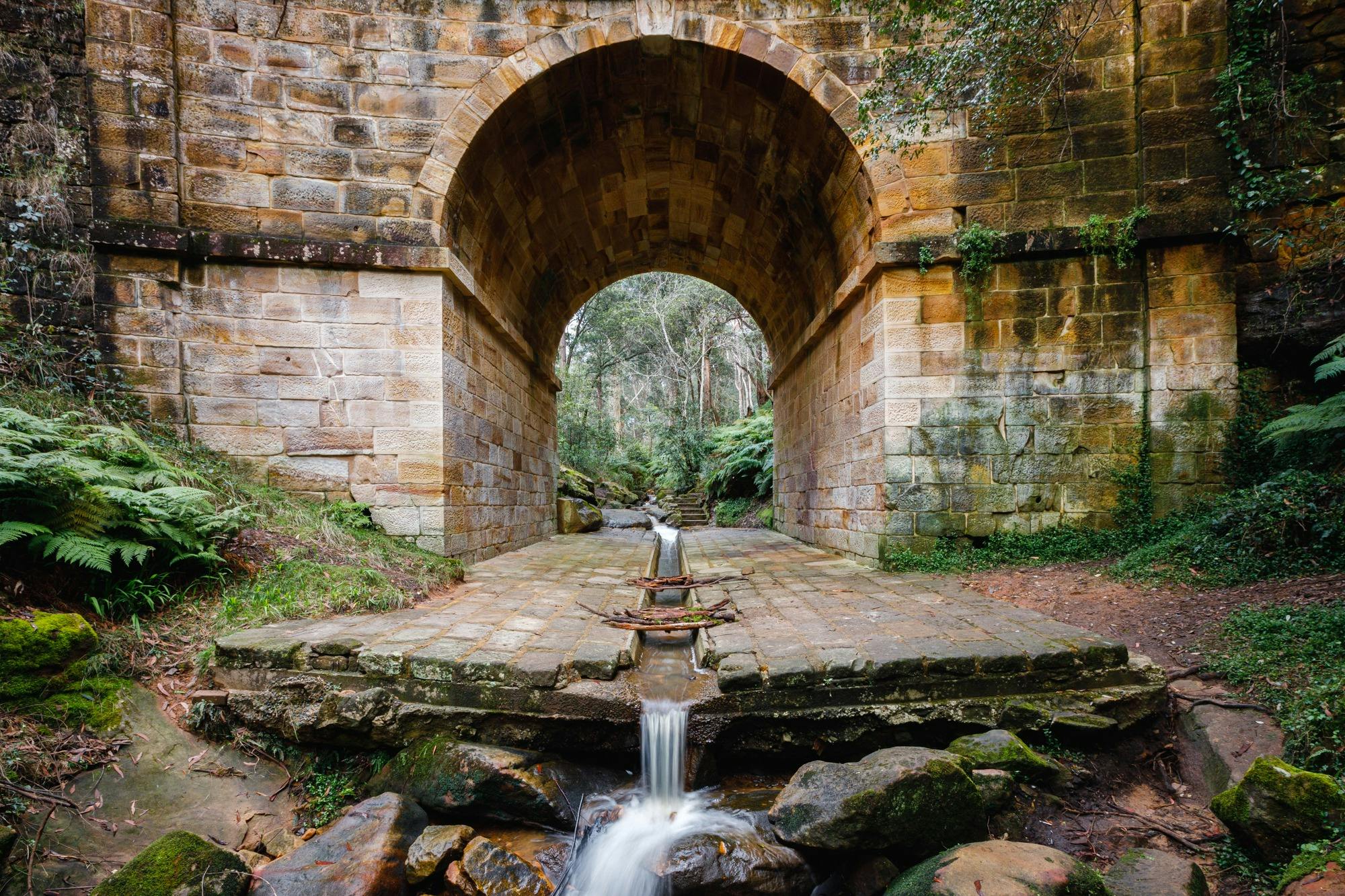 Water Flowing underneath the historic sandstone Lennox Bridge