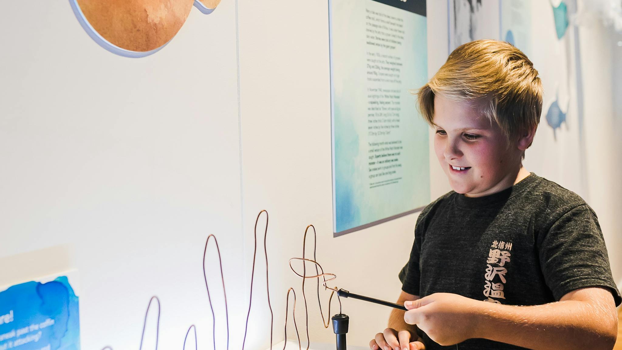 Boy interacting with museum display