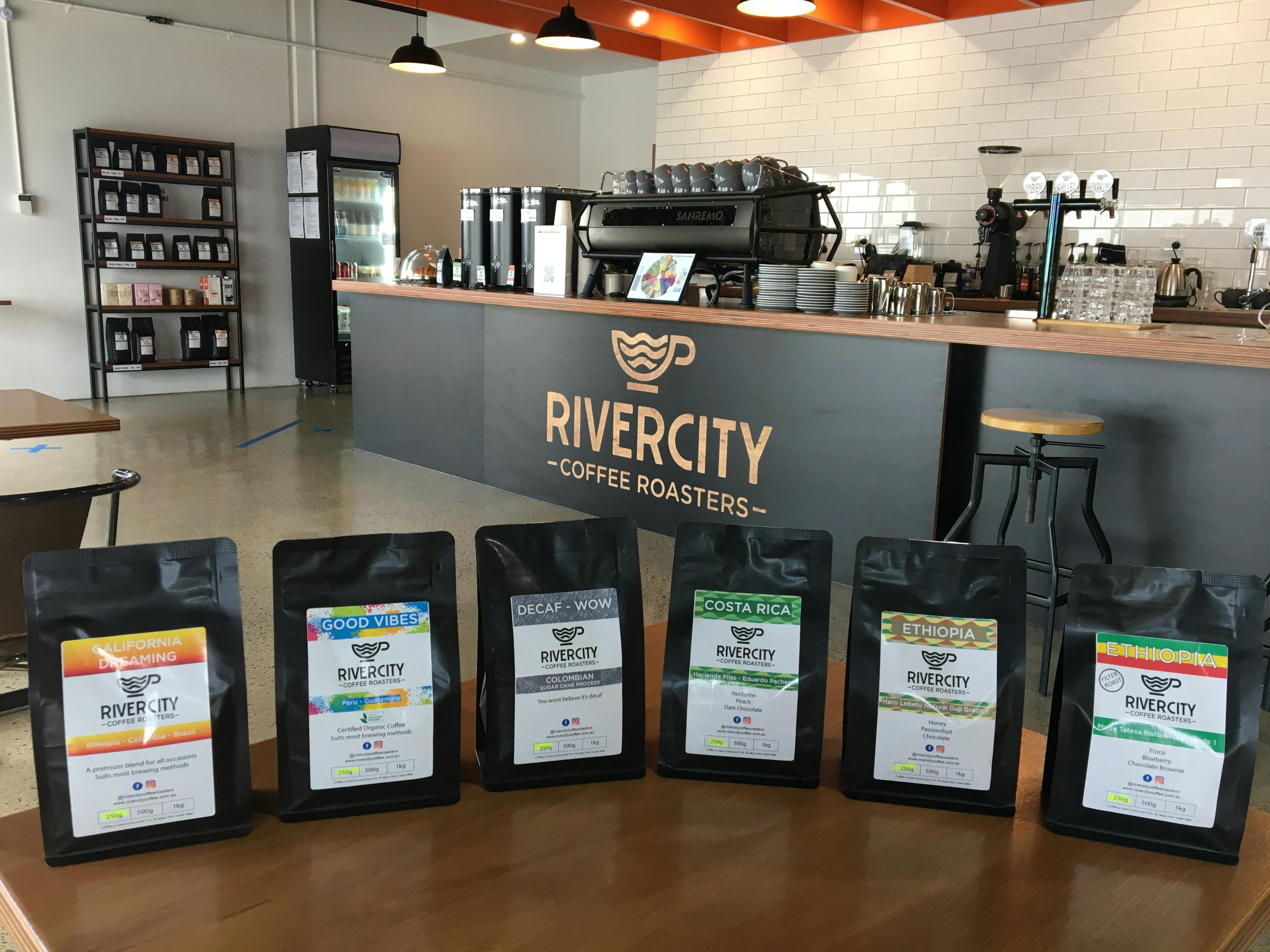 pic of coffee bags in front of cafe counter