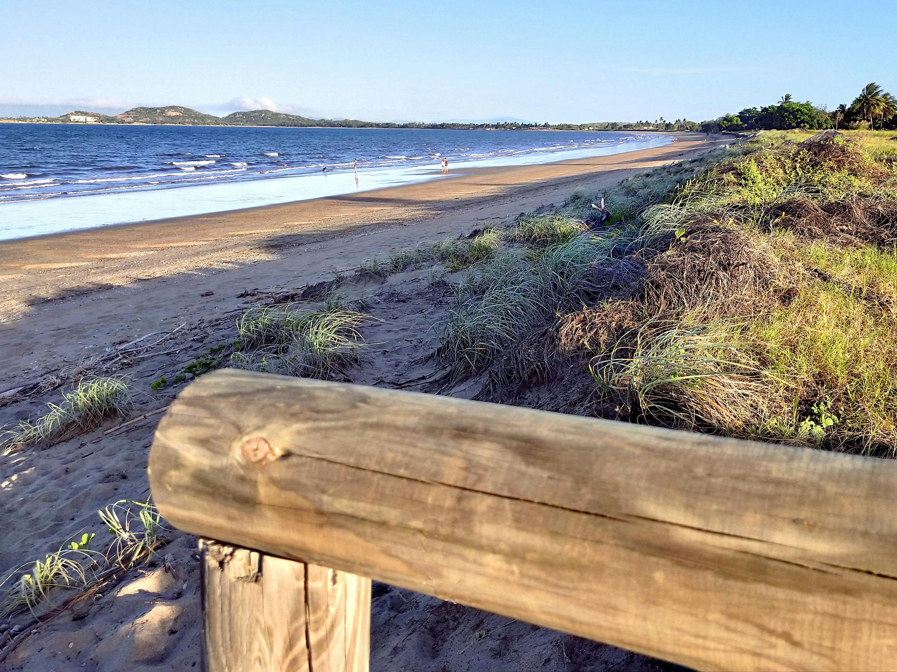 Long sandy beach in afternoon light