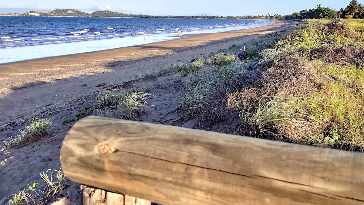 Long sandy beach in afternoon light