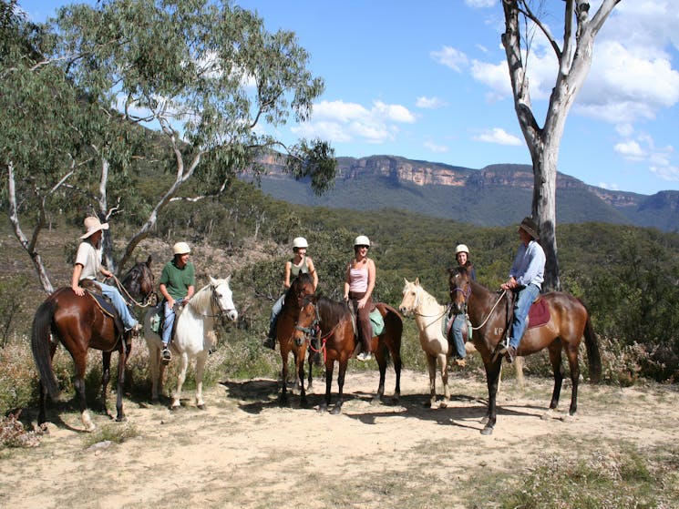 Horse riders enjoying the views of Blue Mountains cliffs in Megalong Valley