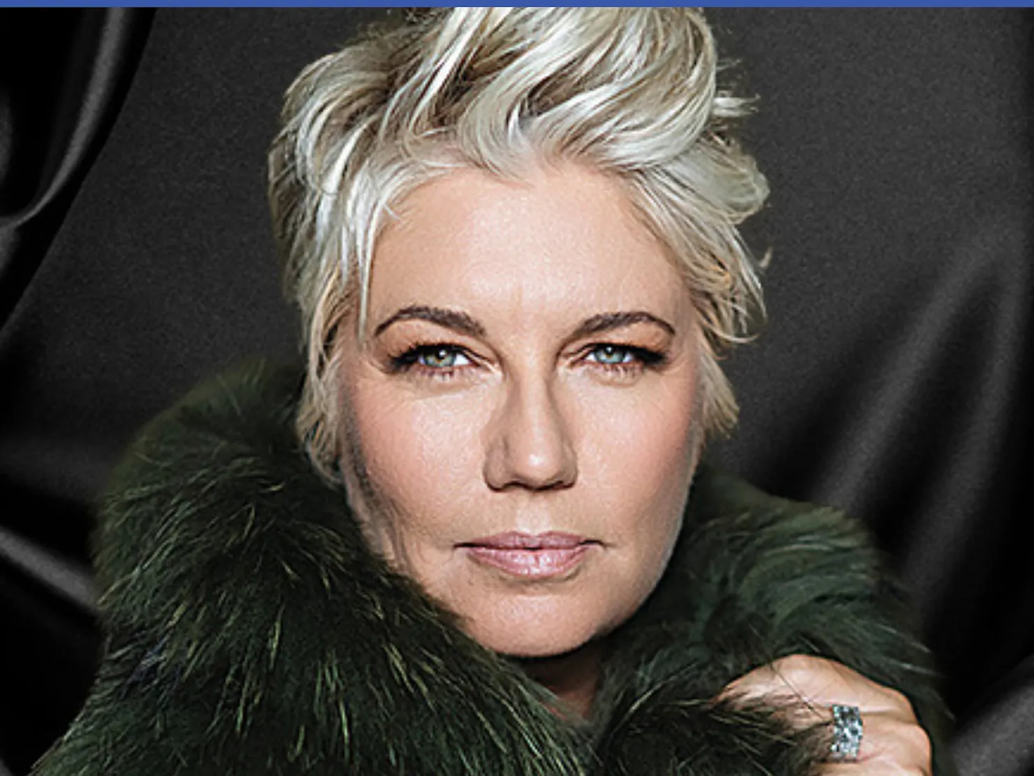 Melinda with short blonde hair swept up