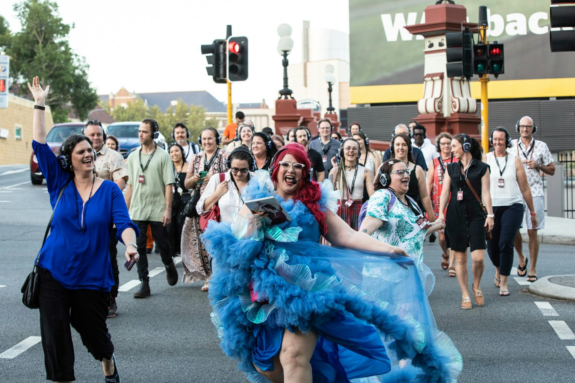 Perth Secrets Tour Group with Famous Sharron dancing across the road