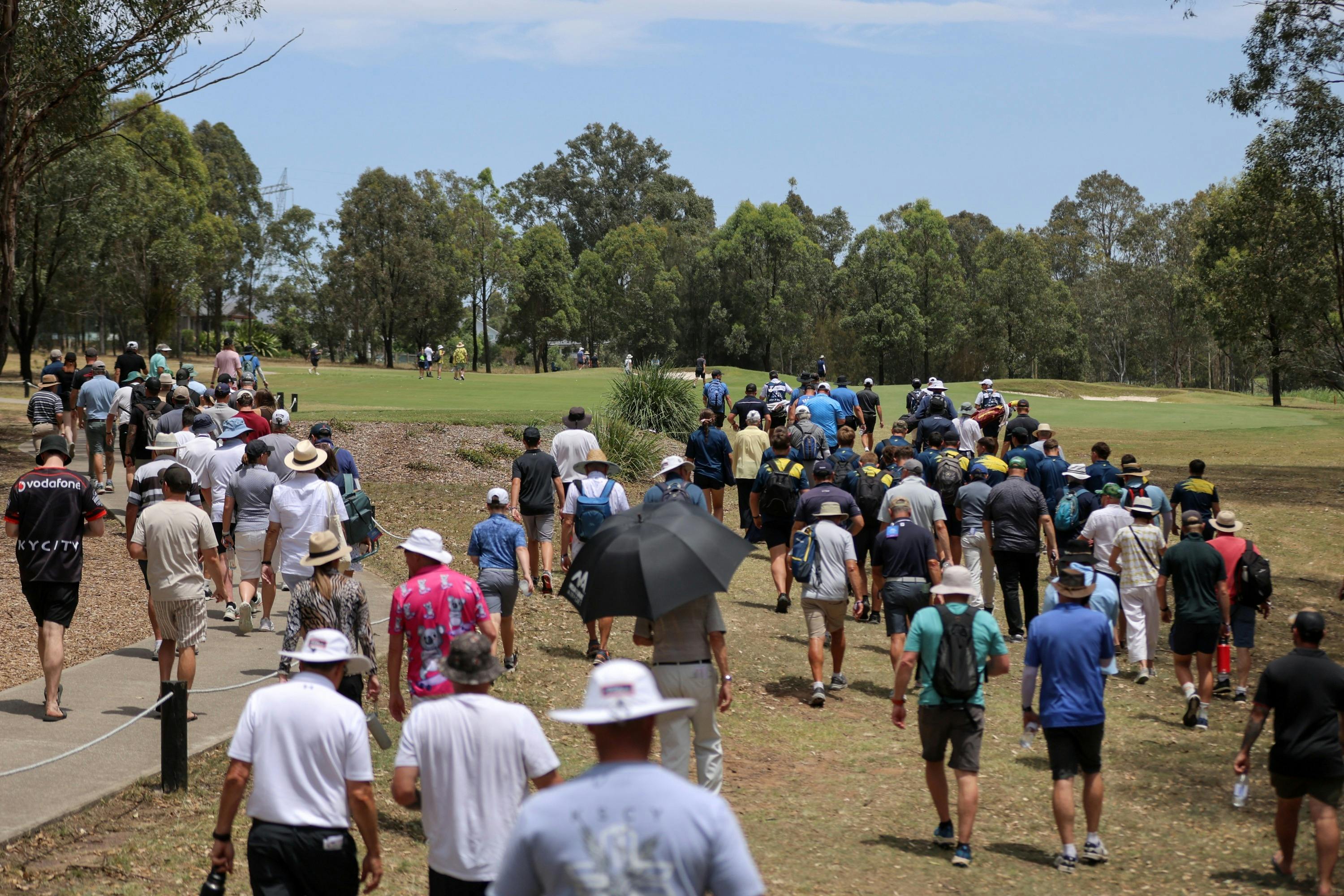 Spectators walking on the fairways