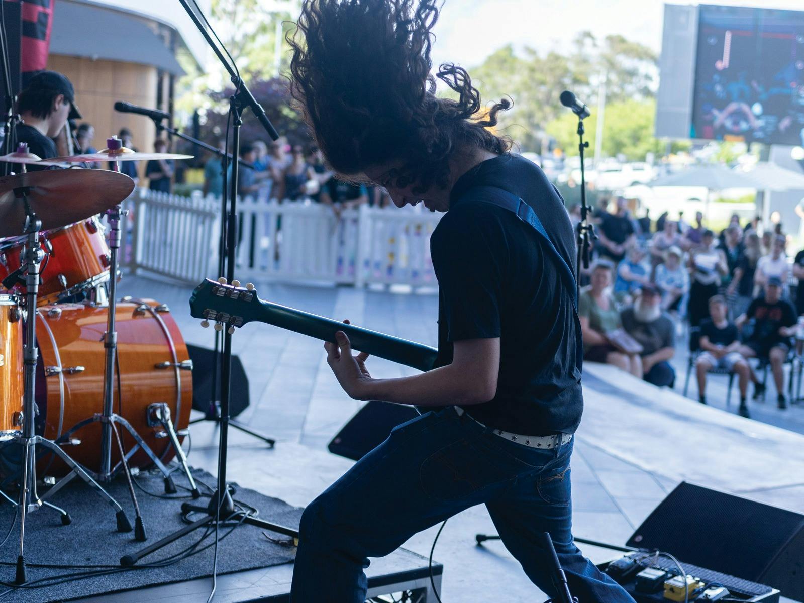 a guitar player on stage