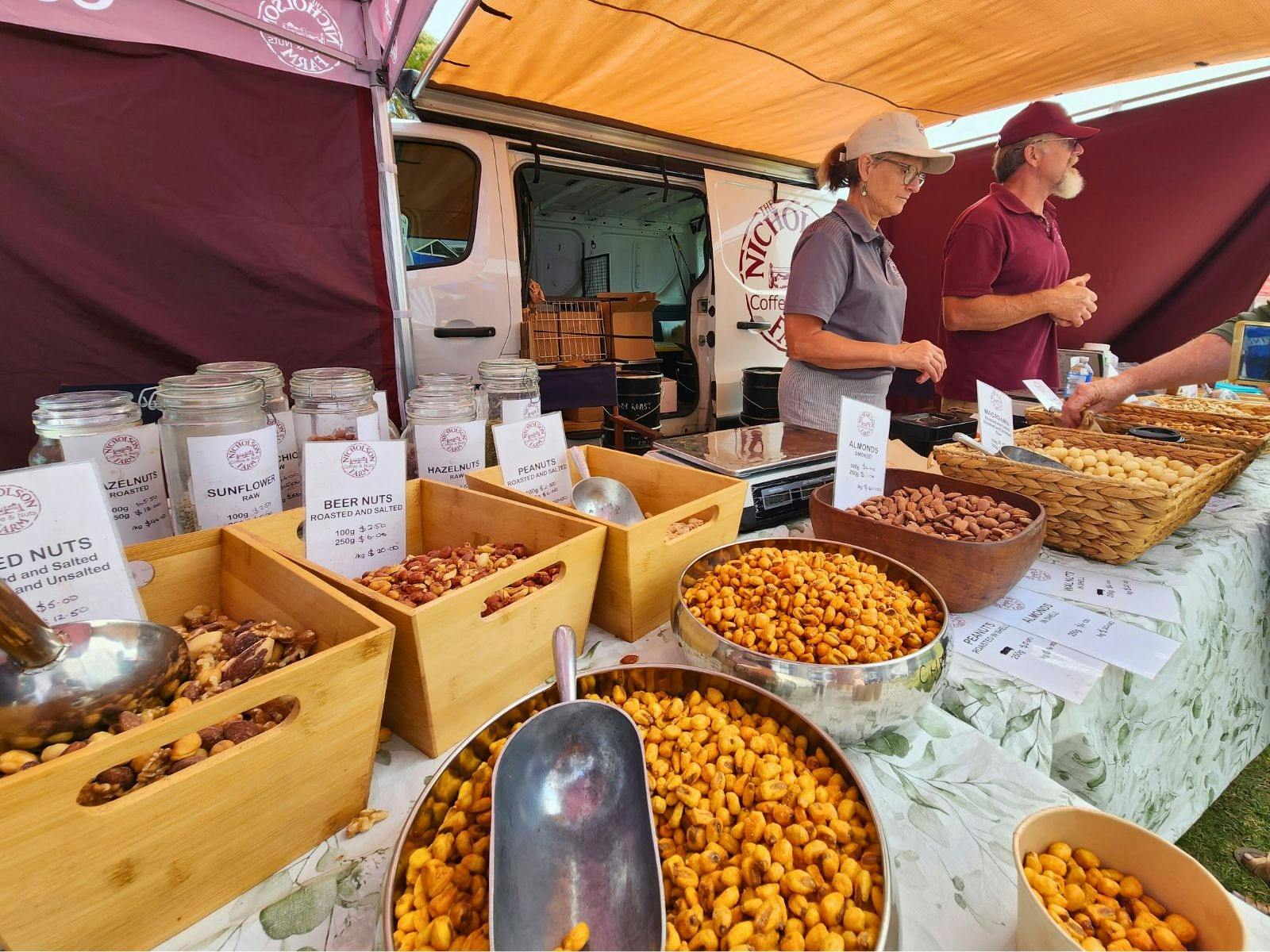Market stall with bowls of different nuts