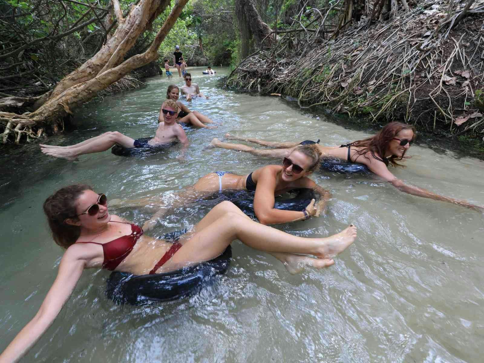 Two women floating in clear water at Eli Creek, K'gari Fraser Island Two women floating in clear water at Eli Creek, K'gari Fraser Island