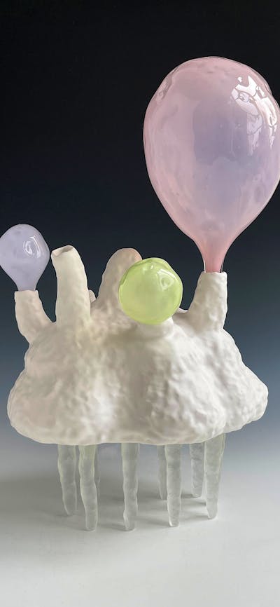 Lynda Draper artwork, made of glazed ceramic and studio blown glass, on grey background
