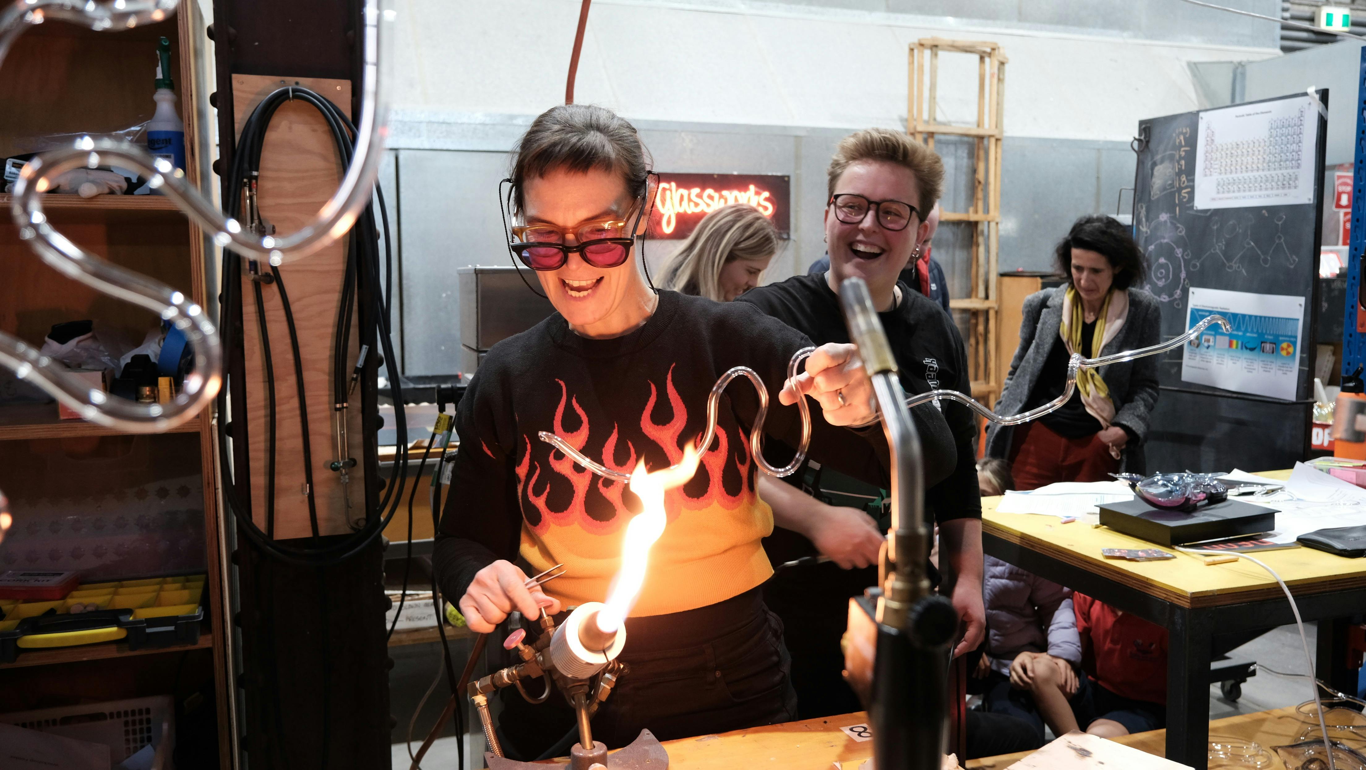 artist bending neon glass