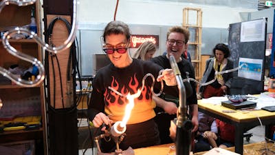 artist bending neon glass