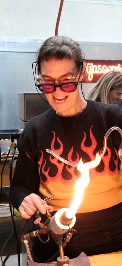 artist bending neon glass