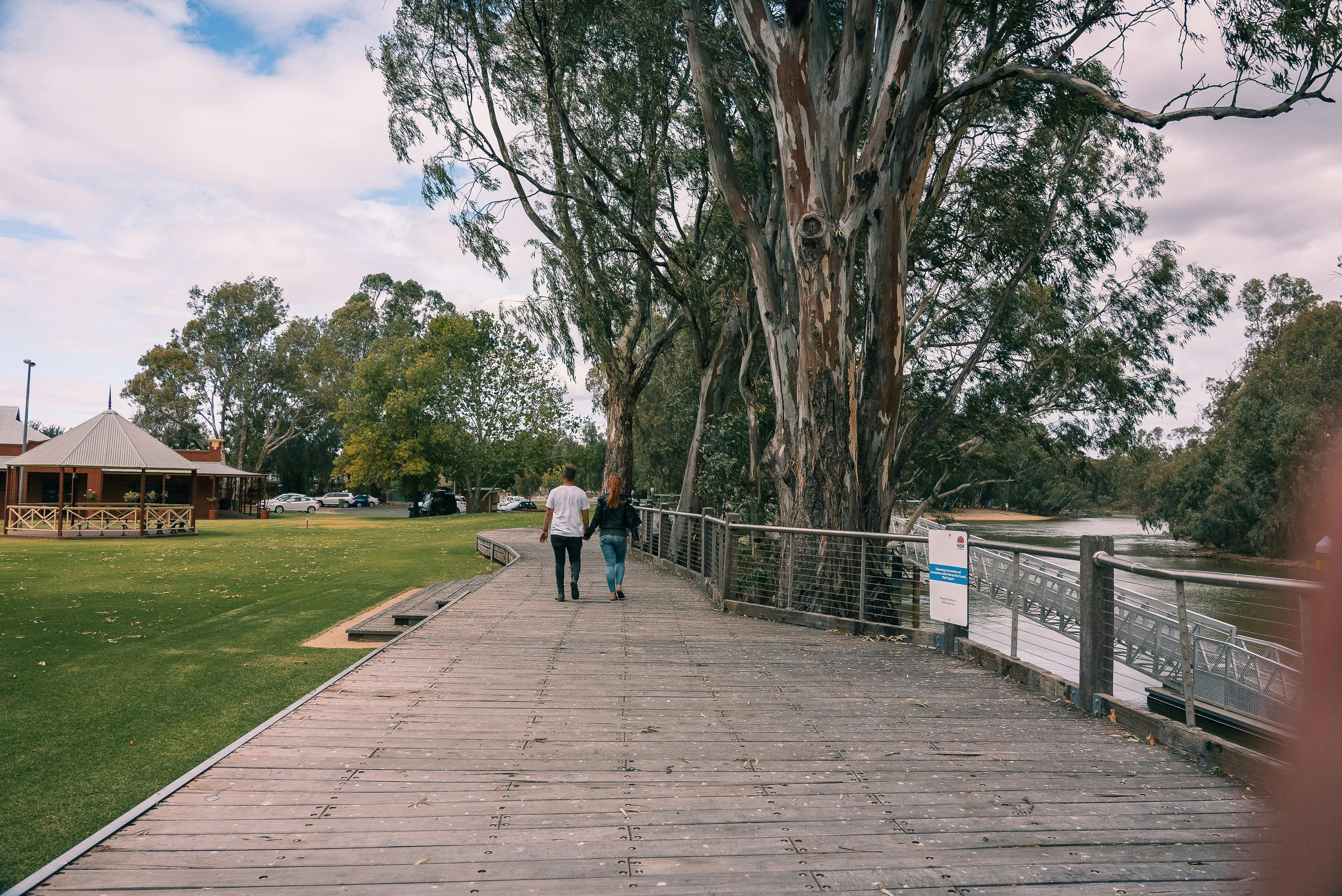 Couple walking on boardwalk