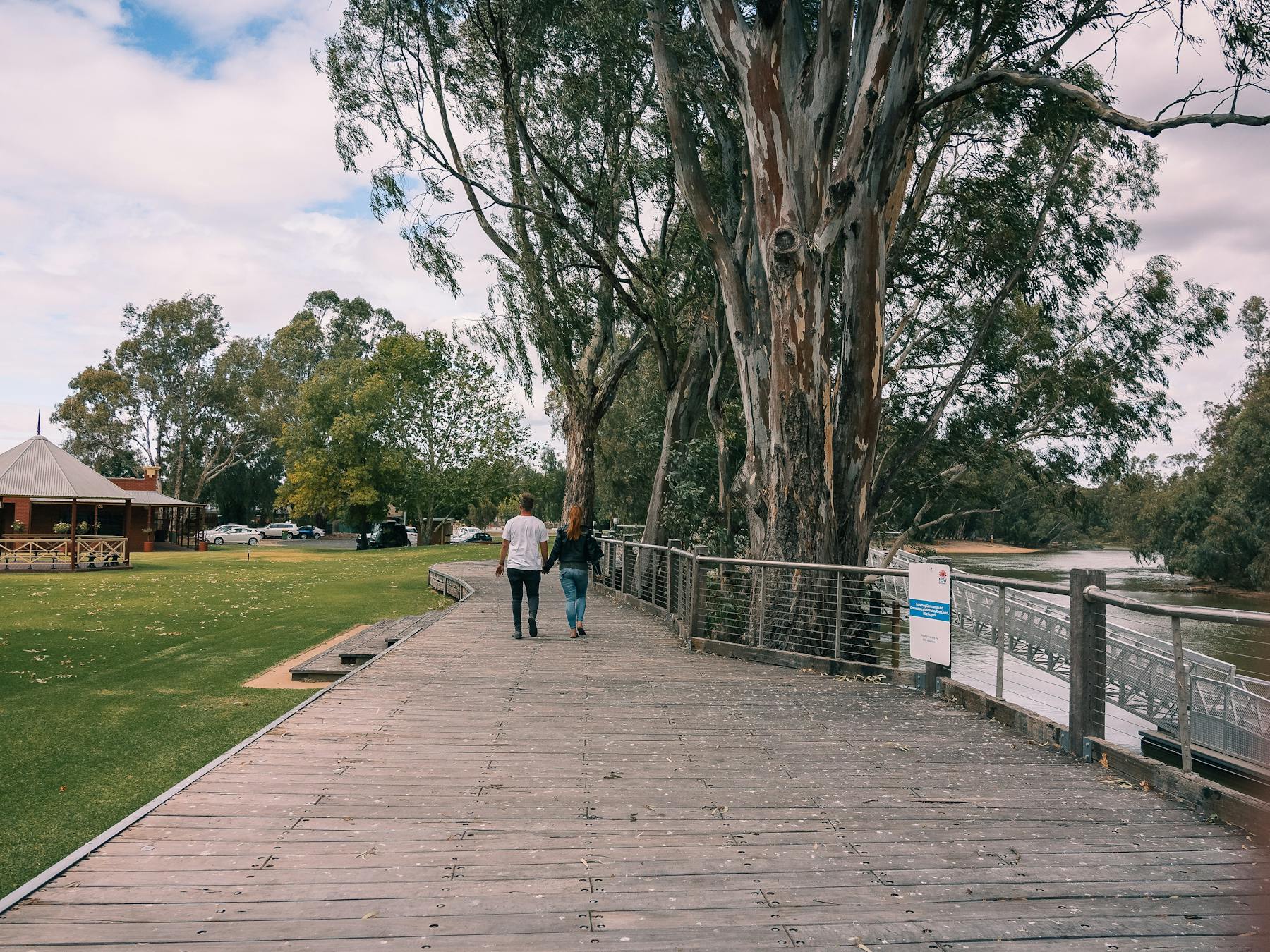 Couple walking on boardwalk