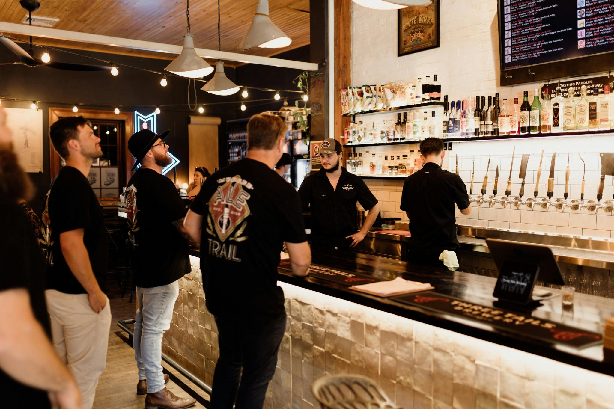 Mudgee Ale Trail clients at the bar ordering their drinks at a local brewery