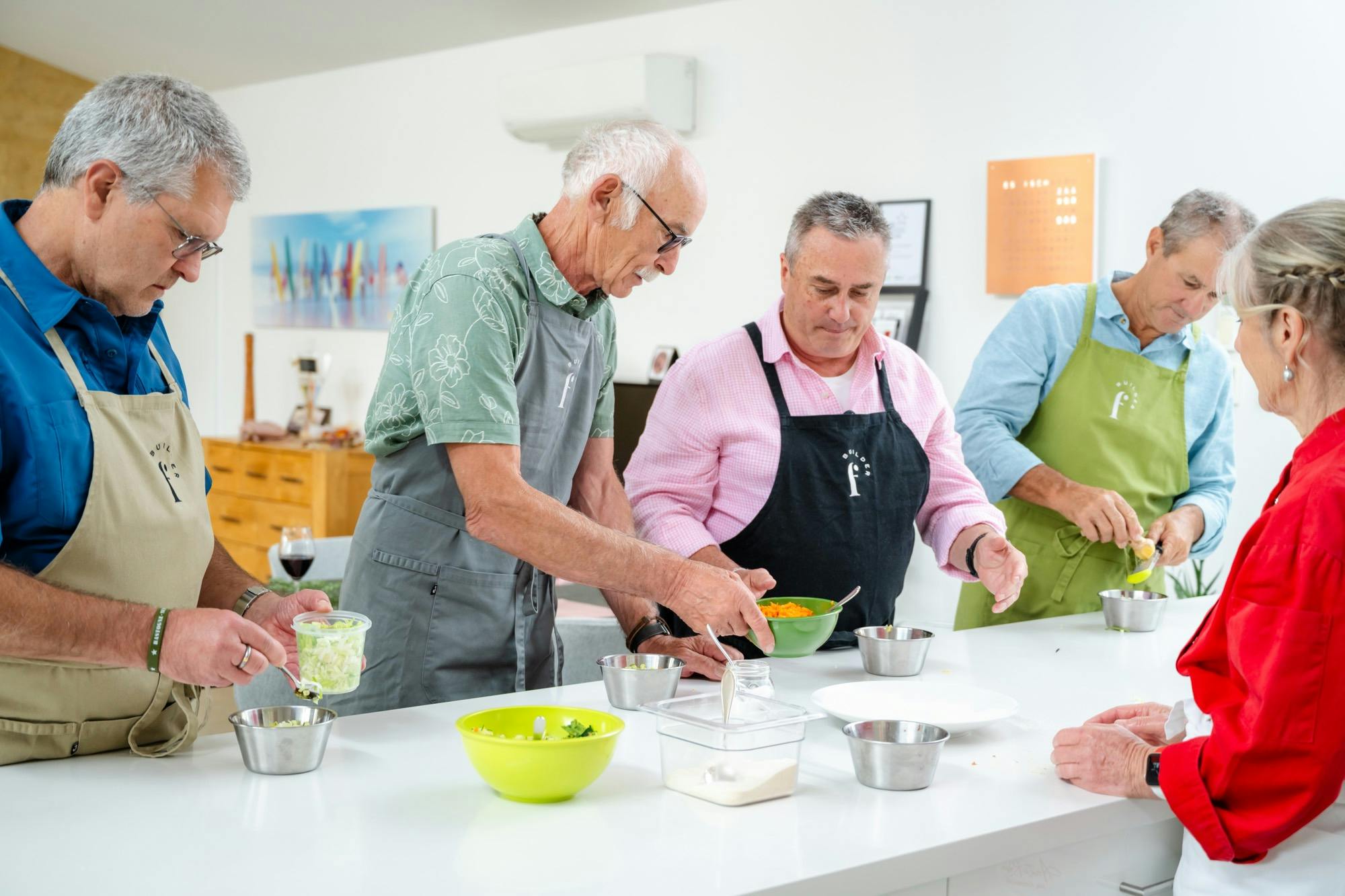 Guests preparing pastry together during a hands-on cooking class with Anita Robin