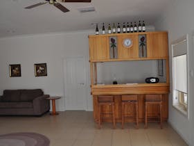 A wooden bar makes drinks service easy in the family room.