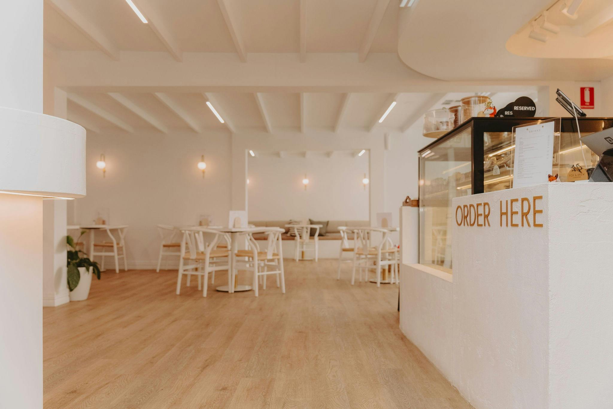 Walk way into Fox and Brew with the Order Here Station on the right