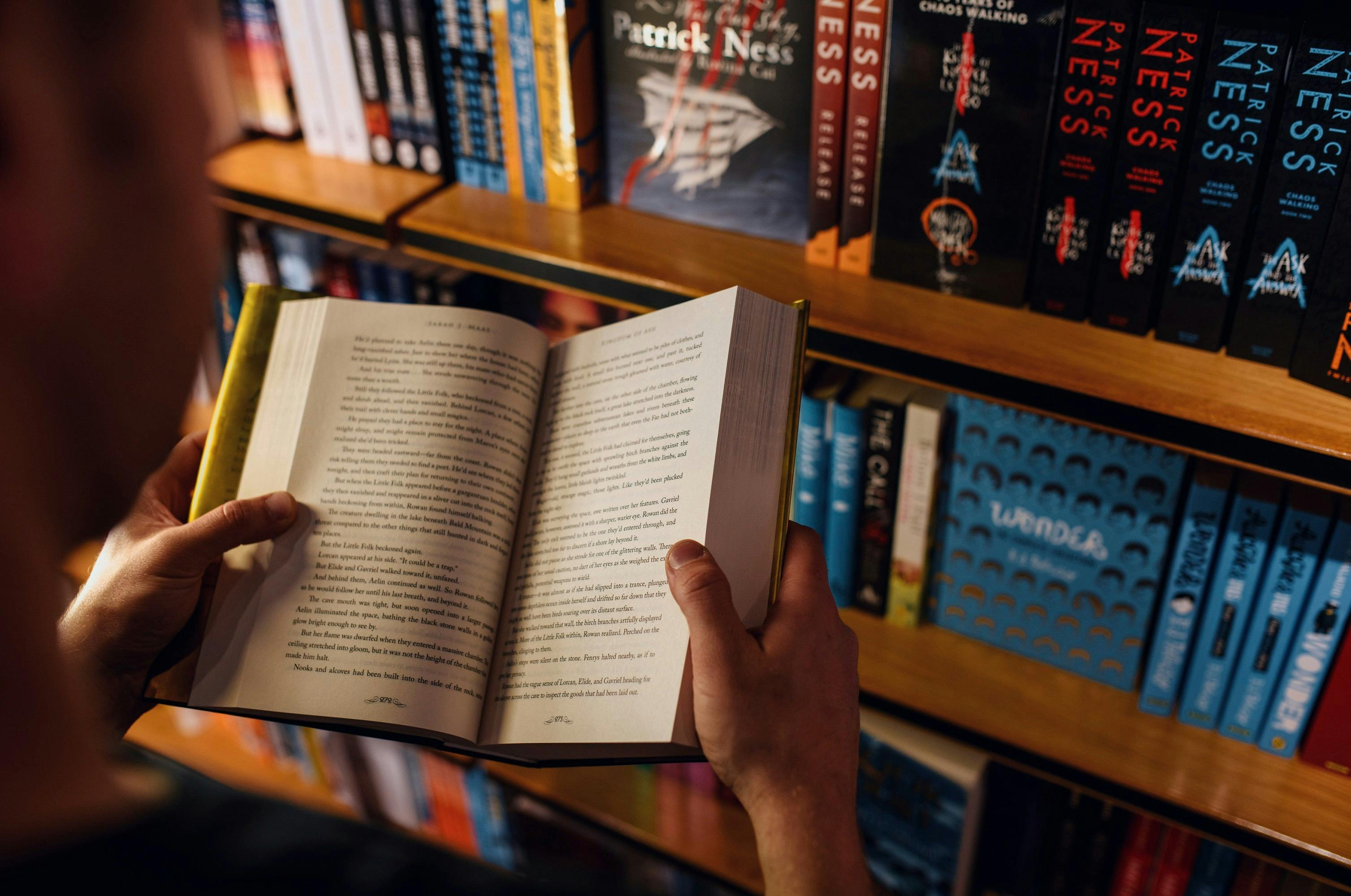 Man browsing books at the Berkelouw Paddington book store on Oxford Street, Paddington