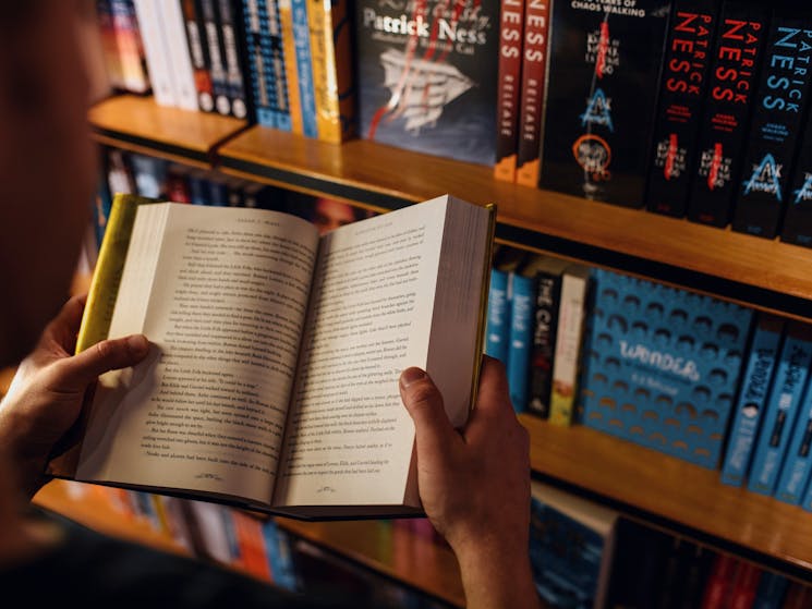 Man browsing books at the Berkelouw Paddington book store on Oxford Street, Paddington