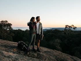 Couple enjoying a scenic walk through Woomargama National Park, Wantagong