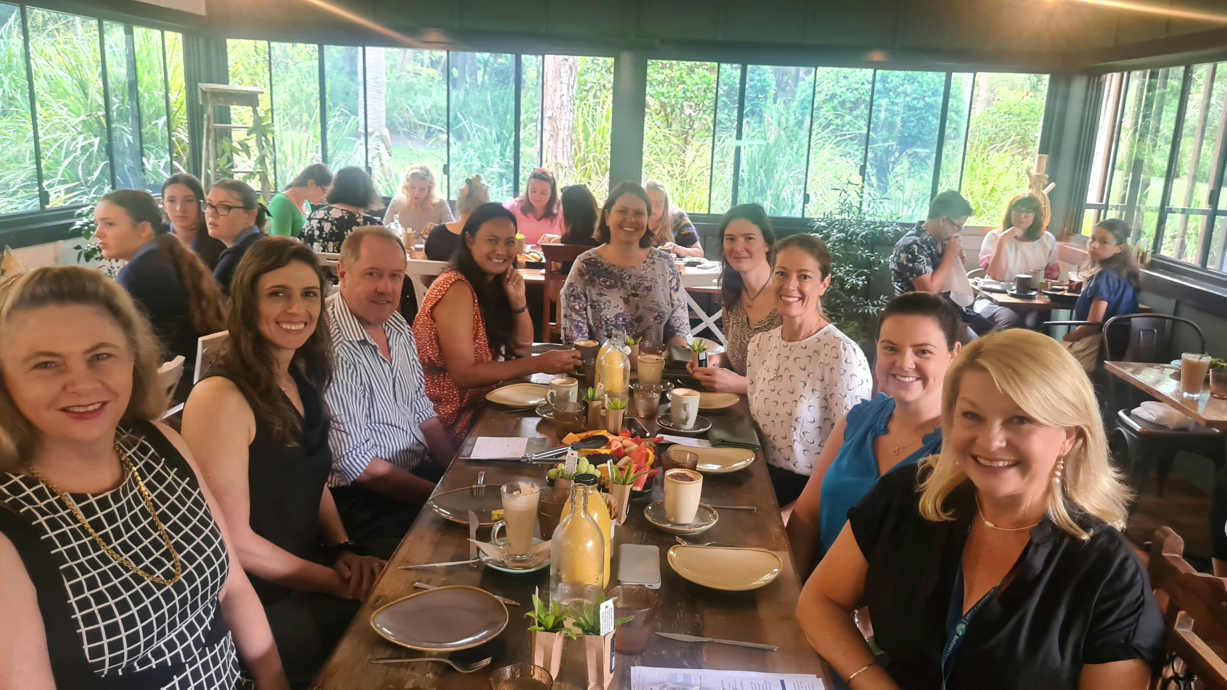 Speakers and guests enjoying breakfast inside IndigiScapes Cafe