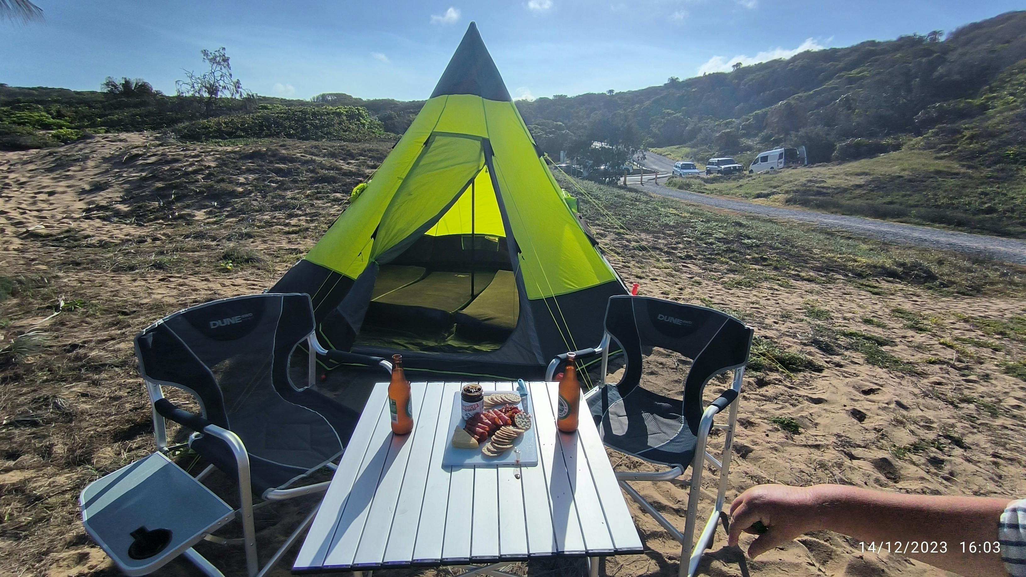 tent setup now time to relax with a couple of beers sitting infront of a tipi tent