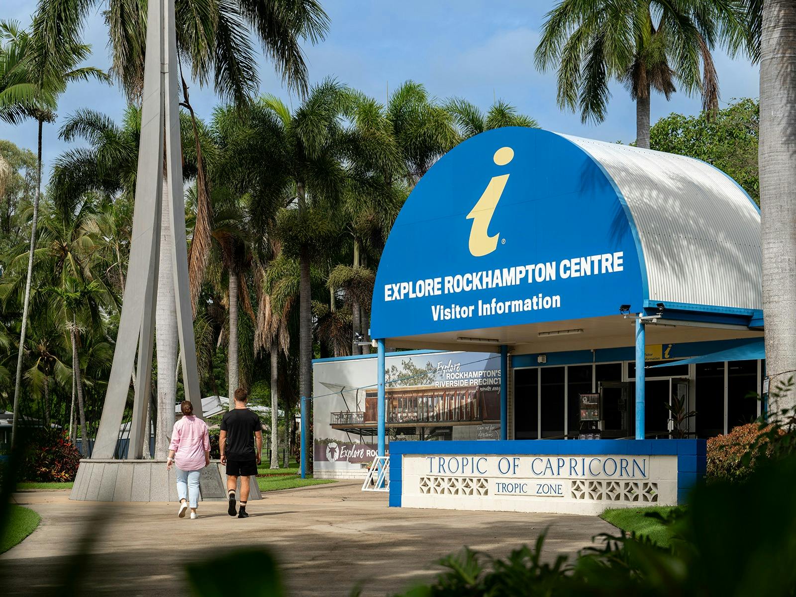 Young travellers visit the Tropic of Capricorn Spire. Young travellers visit the Tropic of Capricorn Spire.