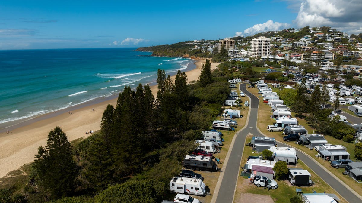 Picture of arial shot of Coolum Beach Holiday Park with ocean and caravan views