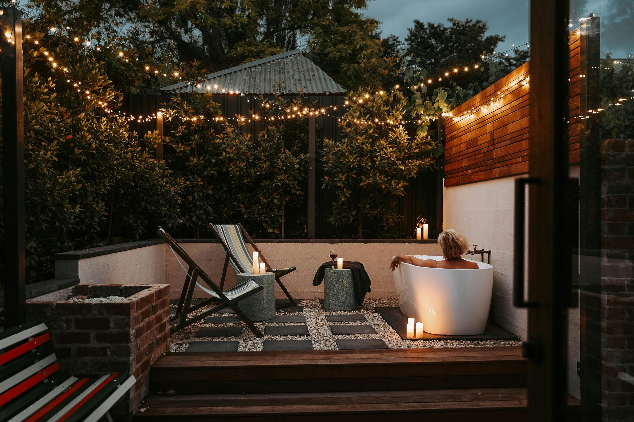 women in outdoor bath at night
