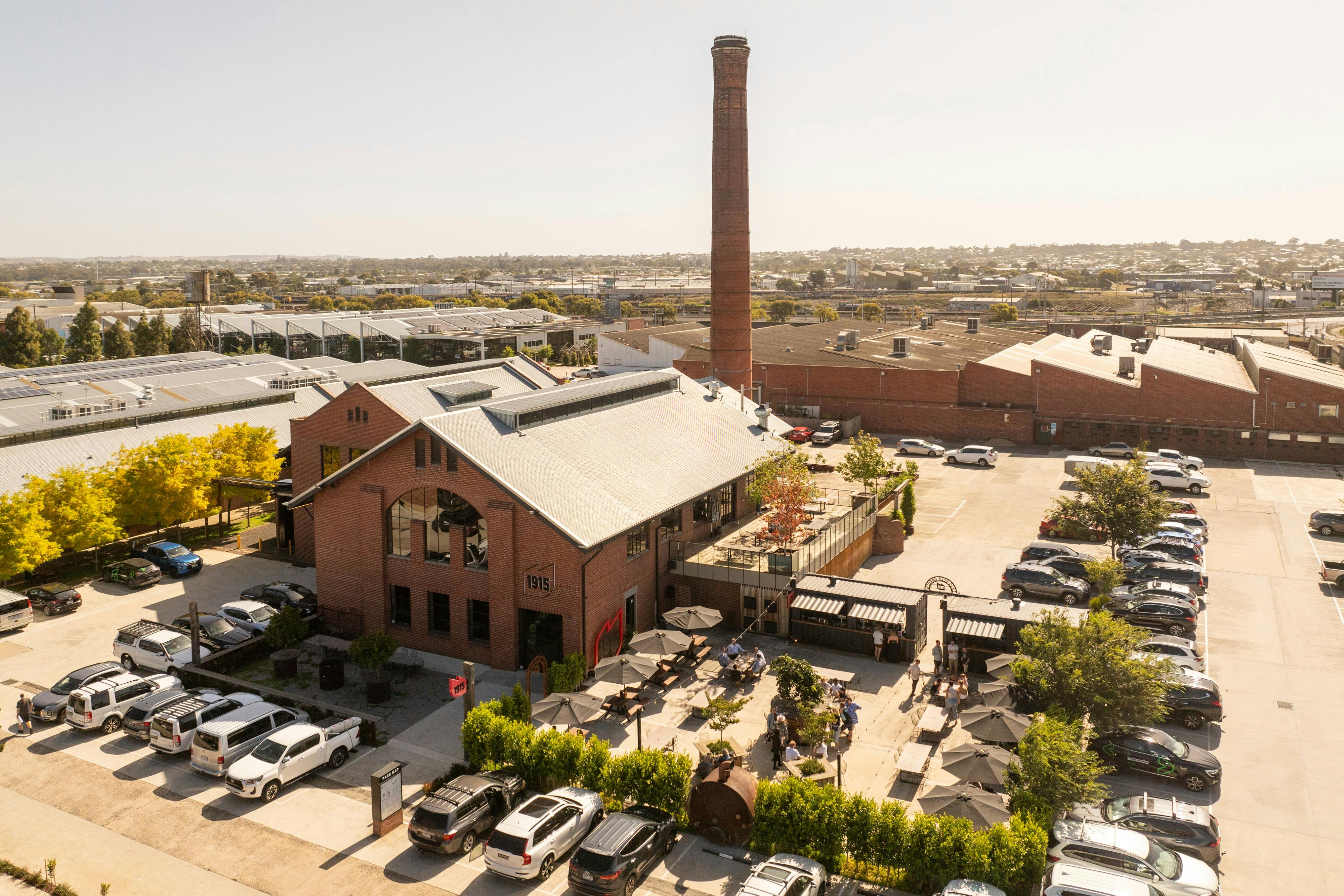 Aerial photo of outside 1915 Restaurant & Bar red brick building