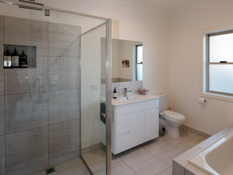 Full size bathroom includes shower and bath