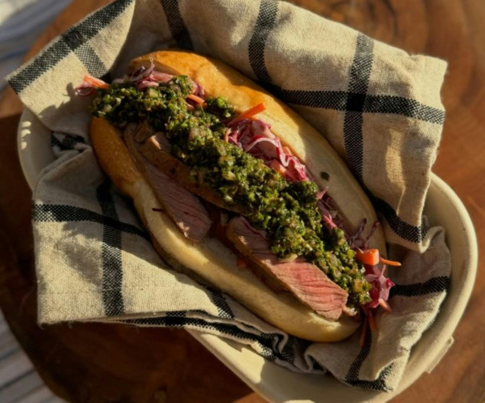 A hotdog style bread roll with delicious BBQ filling