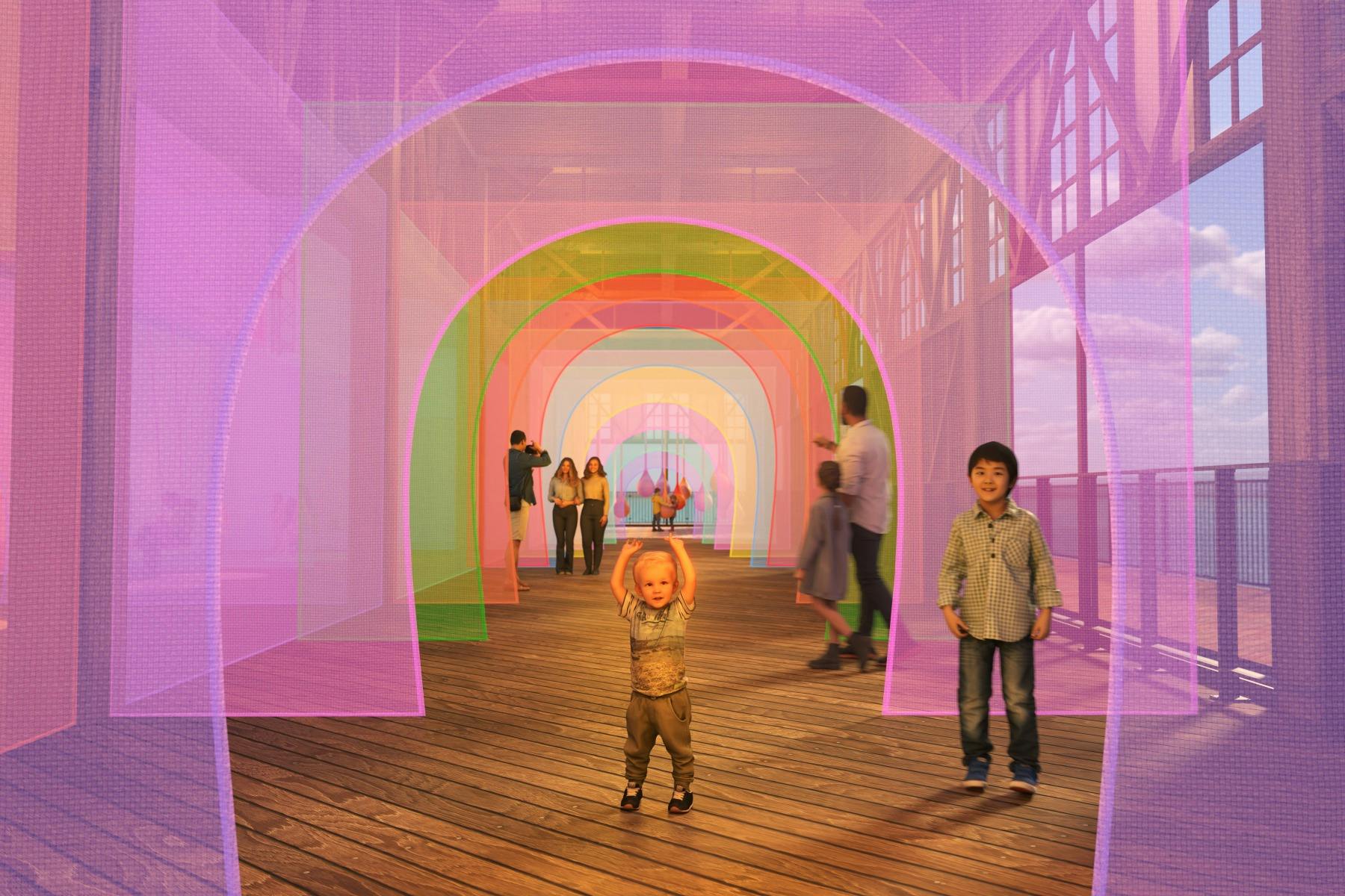 People walking through a tunnel illuminated by pink and purple lights, creating a a sense of wonder