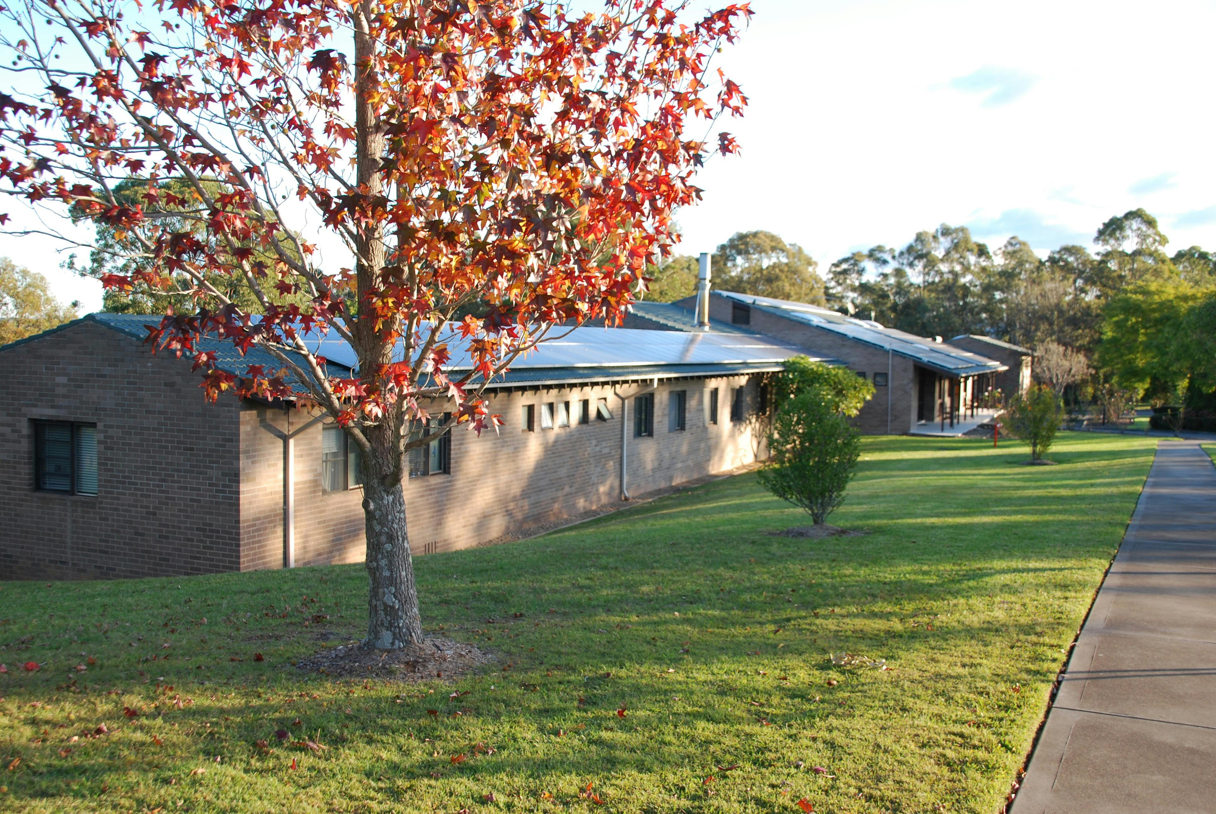 JKH external view along driveway and lawns; offers accommodation and conference facilities