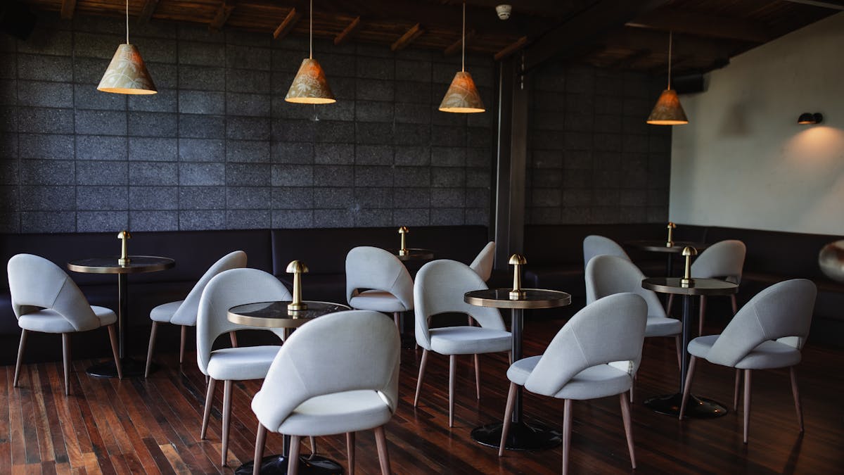 Herve's bar with tables and chairs